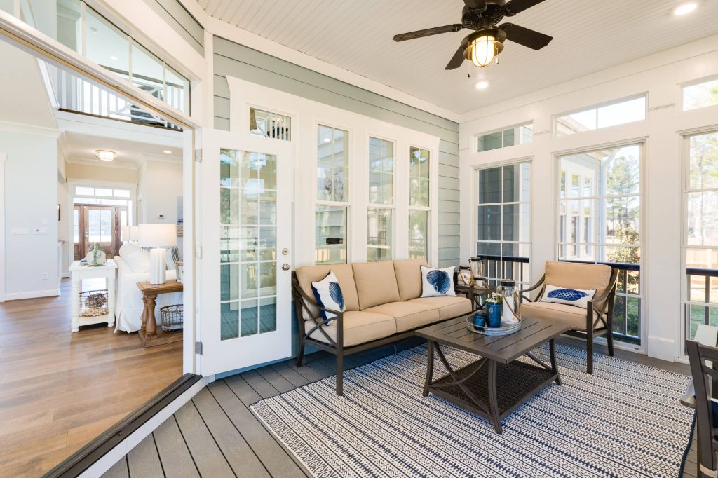 Beach style back porch photo in Other with decking and a roof extension by Stephen Alexander Homes & Neighborhoods | Outdoor Photos | Porch | Landscaping | Landscape Design | Outdoor Living Space | Porch Design Ideas | Outdoor Living Space Ideas | Backyard Design