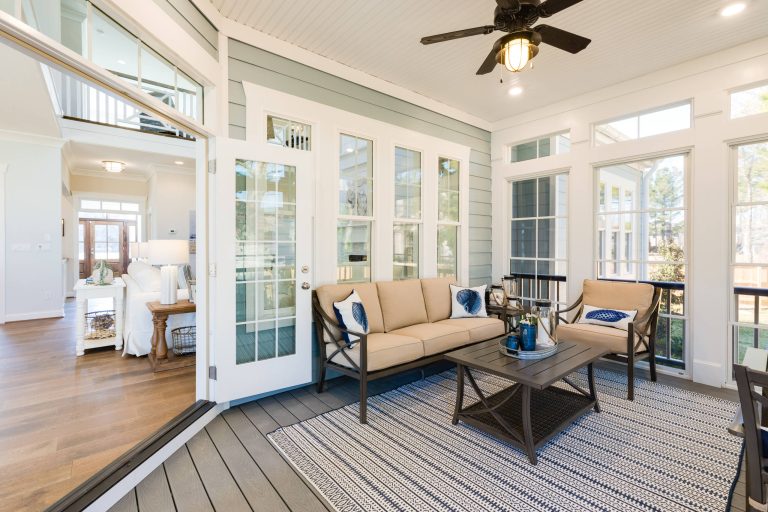Beach style back porch photo in Other with decking and a roof extension by Stephen Alexander Homes & Neighborhoods | Outdoor Photos | Porch | Landscaping | Landscape Design | Outdoor Living Space | Porch Design Ideas | Outdoor Living Space Ideas | Backyard Design