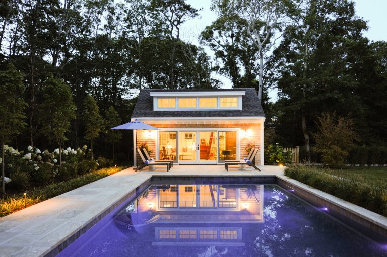Beach style backyard stone and rectangular pool house photo in Boston