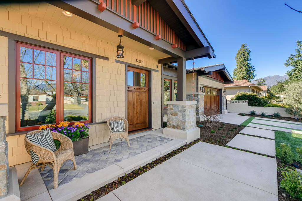 Beach style concrete paver front porch photo in Los Angeles with a roof extension by Tipping Custom Homes | Outdoor Photos | Porch | Landscaping | Landscape Design | Outdoor Living Space | Porch Design Ideas | Outdoor Living Space Ideas | Backyard Design