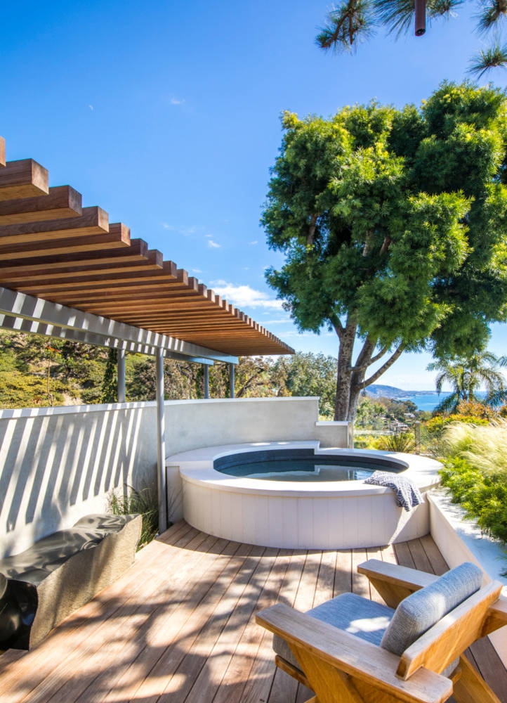 Beach style hot tub photo in Orange County with decking