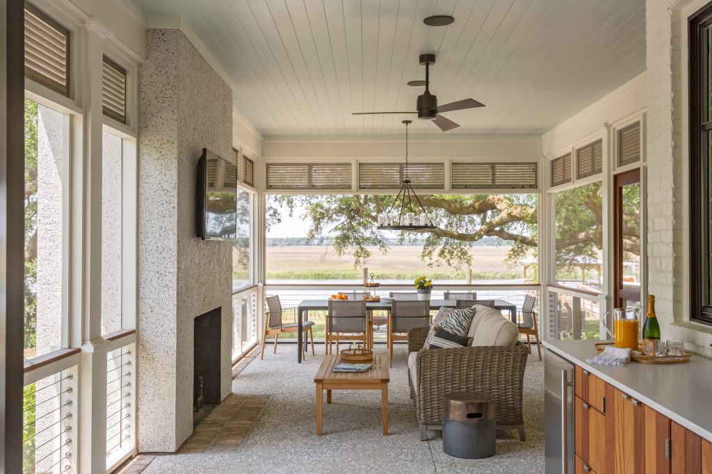 Beach style porch idea in Charleston with a roof extension