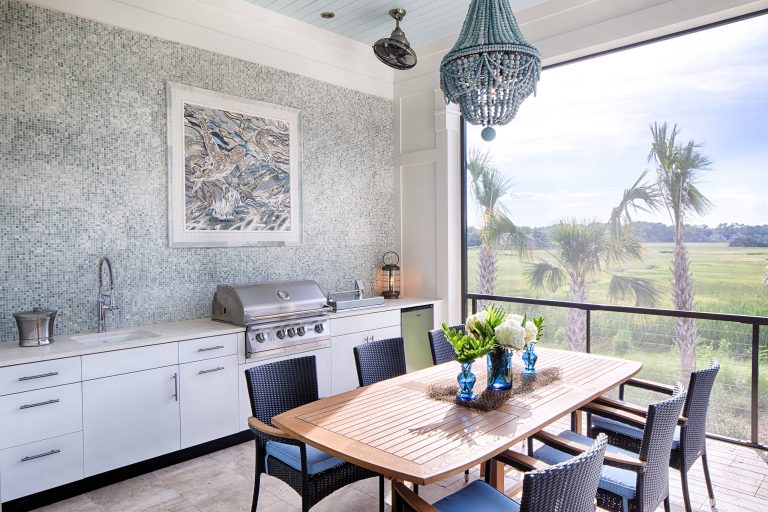 Beach style porch photo in Atlanta with a roof extension by KRA Architecture + Design | Outdoor Photos | Porch | Landscaping | Landscape Design | Outdoor Living Space | Porch Design Ideas | Outdoor Living Space Ideas | Backyard Design