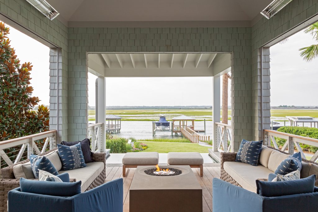 Beach style porch photo in Charleston with decking and a roof extension by Herlong Architects | Outdoor Photos | Porch | Landscaping | Landscape Design | Outdoor Living Space | Porch Design Ideas | Outdoor Living Space Ideas | Backyard Design
