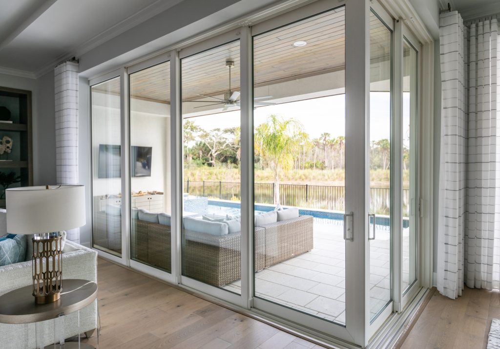 Beach style porch photo in Jacksonville by AR Home Interiors | Outdoor Photos | Porch | Landscaping | Landscape Design | Outdoor Living Space | Porch Design Ideas | Outdoor Living Space Ideas | Backyard Design