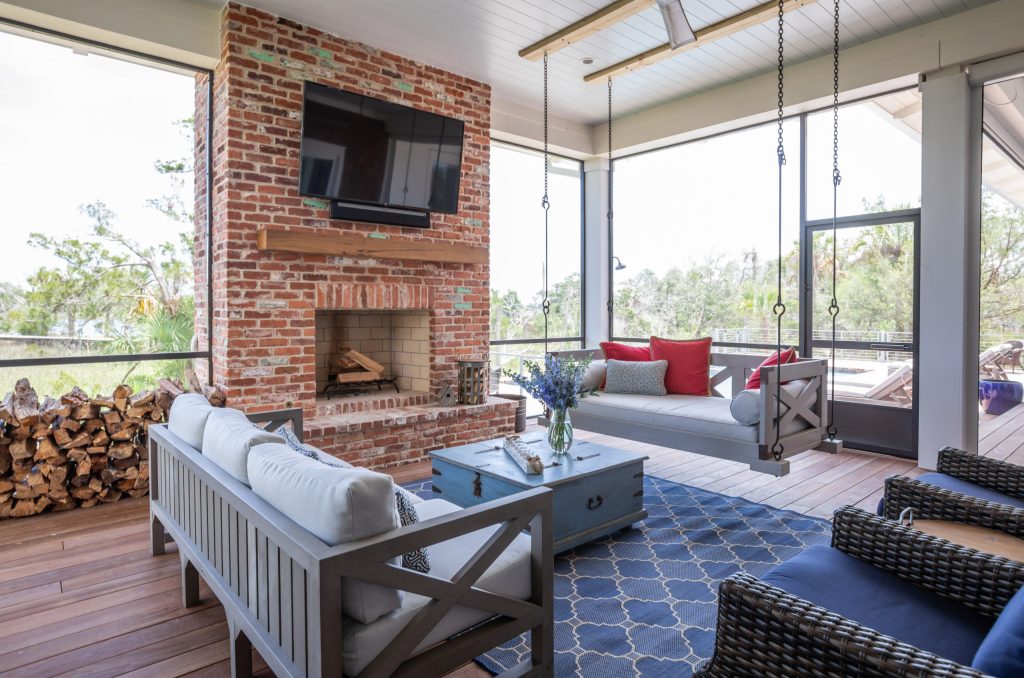 Beach style screened-in porch idea in Jacksonville with decking and a roof extension by Denneen Custom Home Builders | Outdoor Photos | Porch | Landscaping | Landscape Design | Outdoor Living Space | Porch Design Ideas | Outdoor Living Space Ideas | Backyard Design