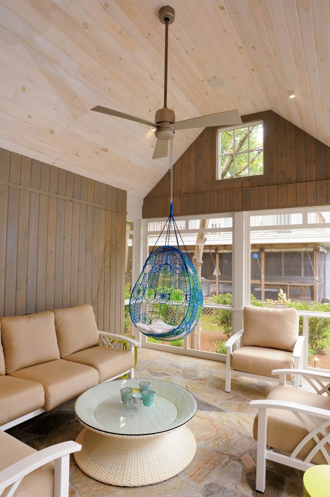 Beach style stone porch idea in Other with a roof extension by Burton Builders | Outdoor Photos | Porch | Landscaping | Landscape Design | Outdoor Living Space | Porch Design Ideas | Outdoor Living Space Ideas | Backyard Design