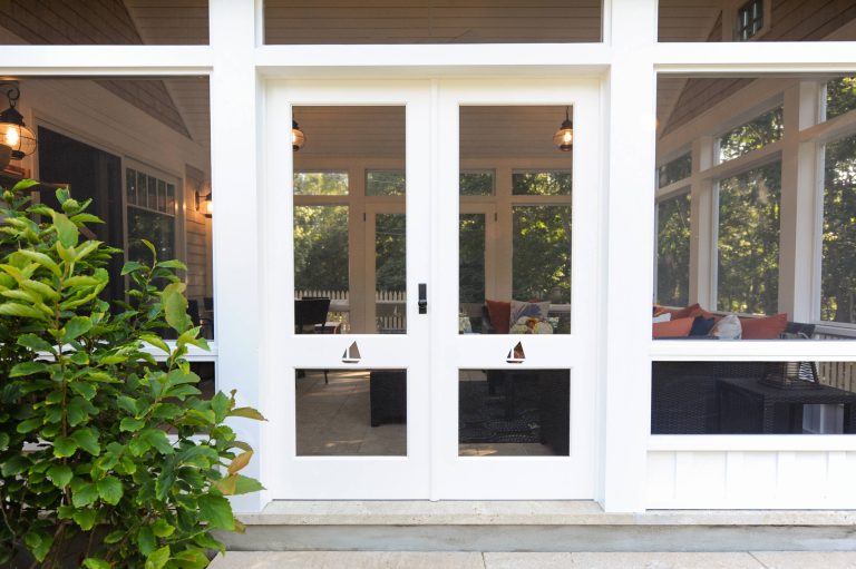 Beach style stone screened-in back porch photo in Boston with a roof extension by Salt Architecture Inc. | Outdoor Photos | Porch | Landscaping | Landscape Design | Outdoor Living Space | Porch Design Ideas | Outdoor Living Space Ideas | Backyard Design