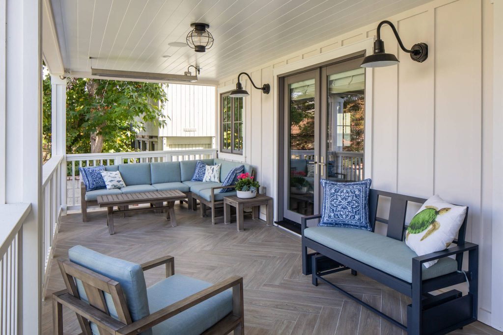 Beach style tile porch photo in Los Angeles with a roof extension by Christine Vroom Interiors | Outdoor Photos | Porch | Landscaping | Landscape Design | Outdoor Living Space | Porch Design Ideas | Outdoor Living Space Ideas | Backyard Design