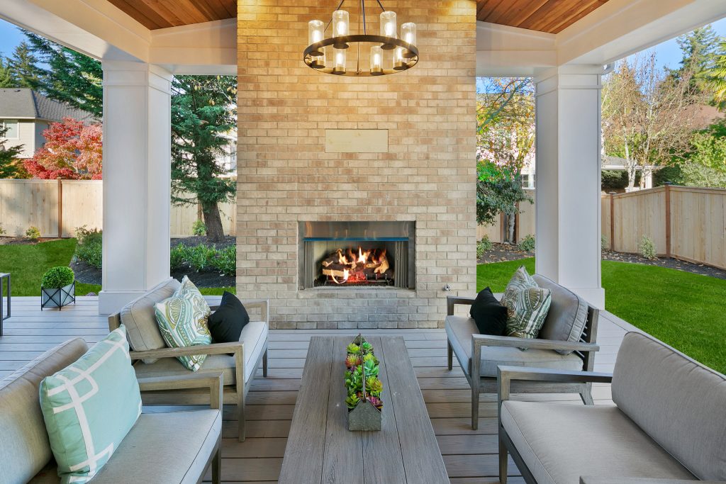 Beautiful outdoor fireplace with brick surround.