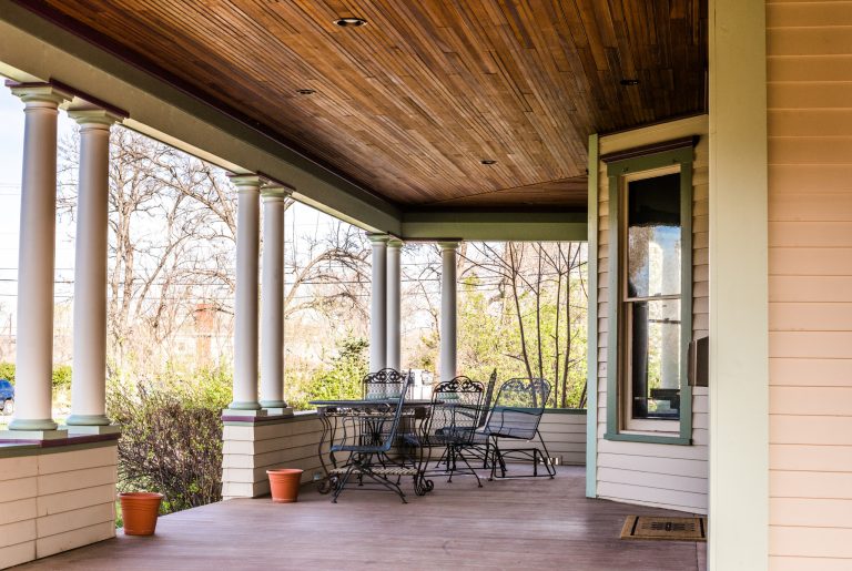 Beautifully restored historic wrap-around porch. Photography by Kim Lathe Photography.