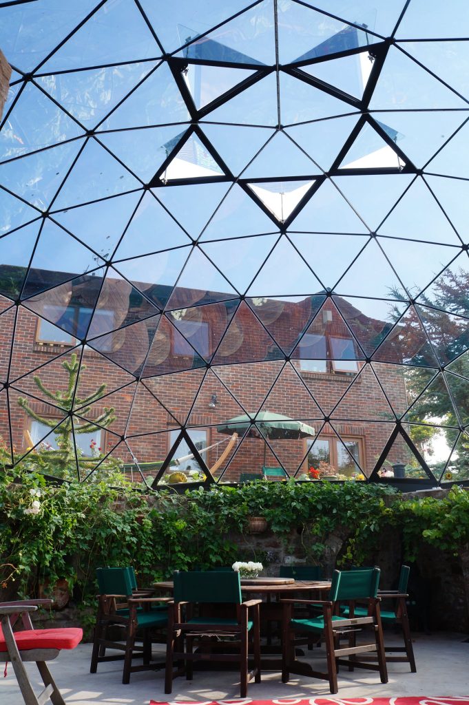 Bespoke 8m diameter Solardome glass and aluminium skylight over a sunken garden.