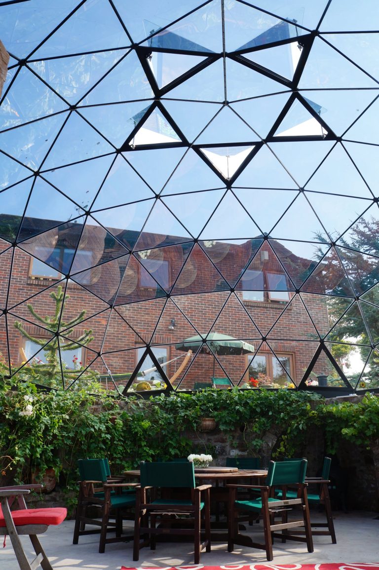 Bespoke 8m diameter Solardome glass and aluminium skylight over a sunken garden.