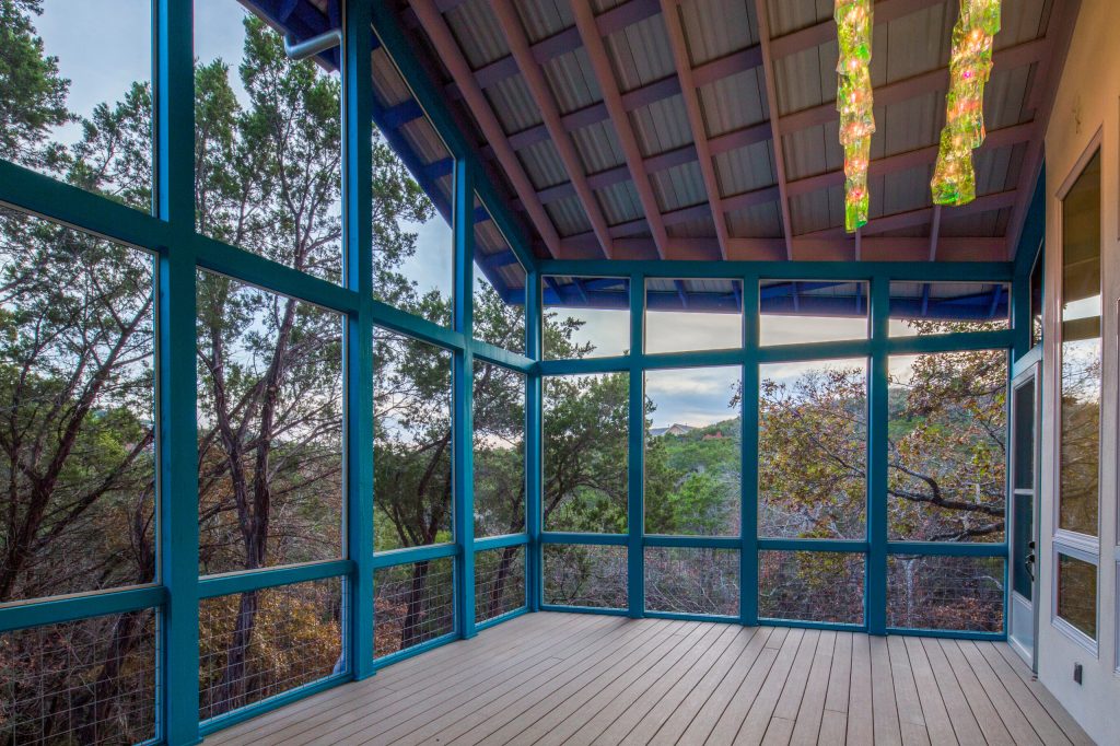 Blue Horse Building + Design // Tre Dunham Fine Focus Photography Mid-sized eclectic screened-in back porch idea in Austin with decking and a roof extension by Blue Horse Building & Design | Outdoor Photos | Porch | Landscaping | Landscape Design | Outdoor Living Space | Porch Design Ideas | Outdoor Living Space Ideas | Backyard Design