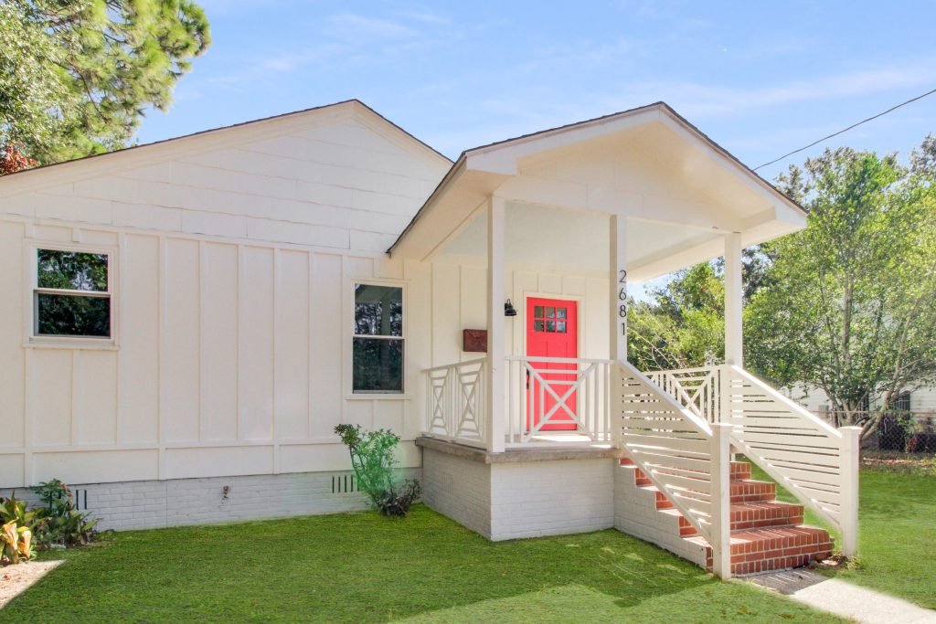 Board and Batten siding, with original brick steps.