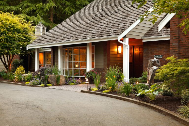 Brick porch idea in Seattle with a roof extension by Alderwood Landscape Architecture and Construction | Outdoor Photos | Porch | Landscaping | Landscape Design | Outdoor Living Space | Porch Design Ideas | Outdoor Living Space Ideas | Backyard Design
