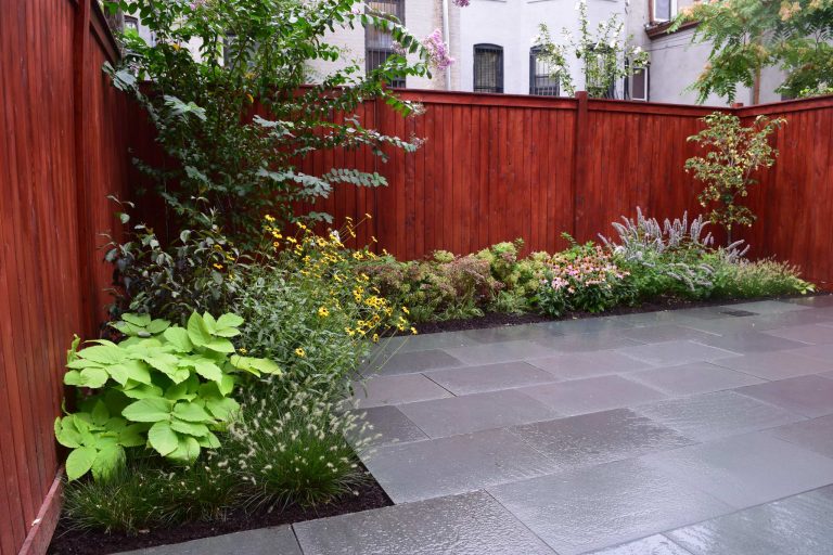 Brooklyn Backyard Oasis. Blue stone patio, Ceder privacy fence.