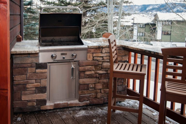 Built in BBQ and bar seats offer a great functional aspect to the small deck.
