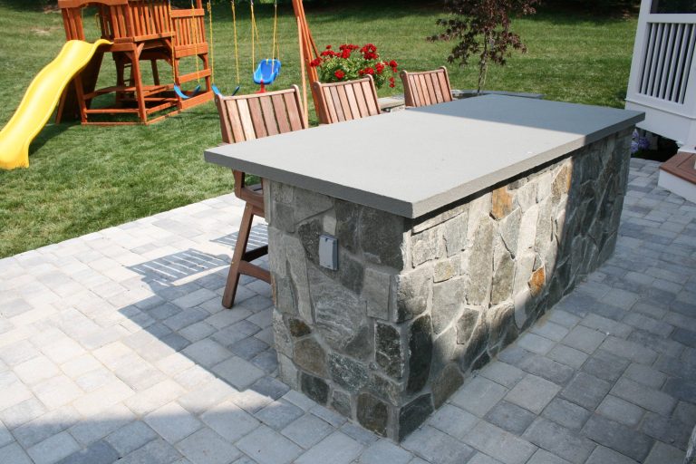 Built-in grill and serving/bar area. Bluestone with Sterling Rustic veneer.