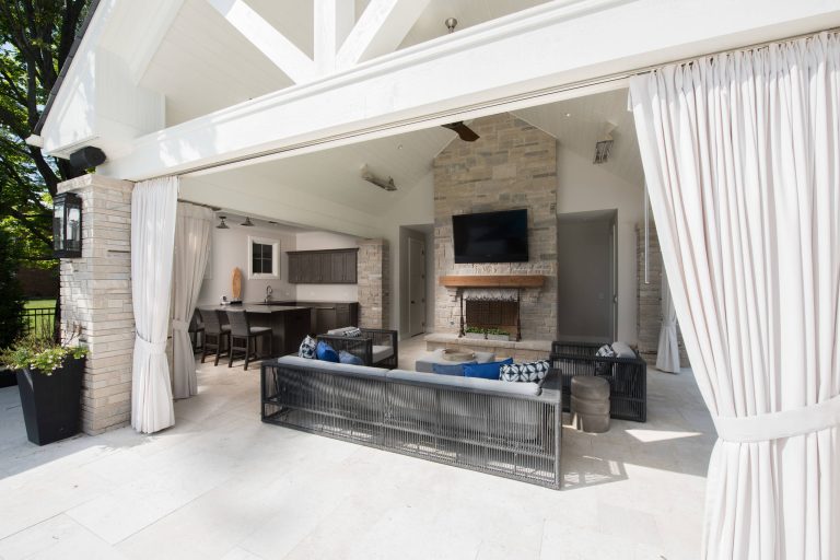Cabana with living space, fireplace, tv, and outdoor kitchen