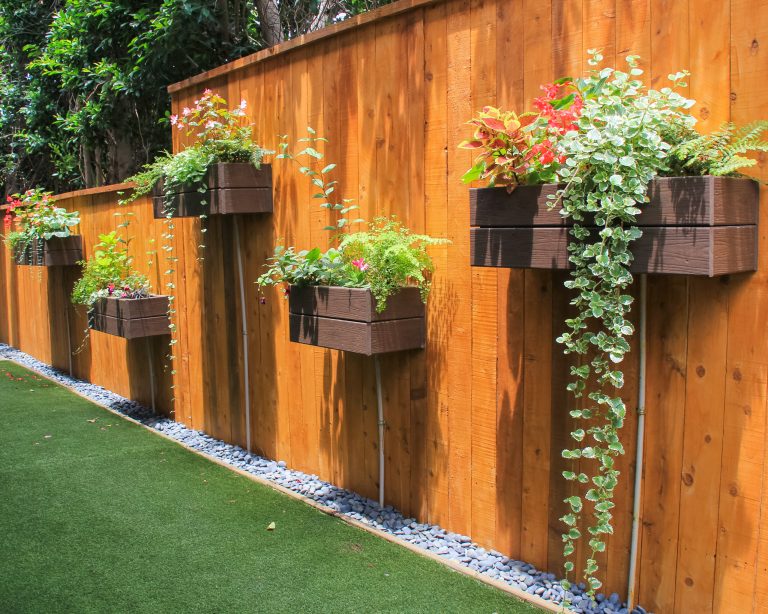 Cedar fence and planter boxes photo by Bronwyn Miller