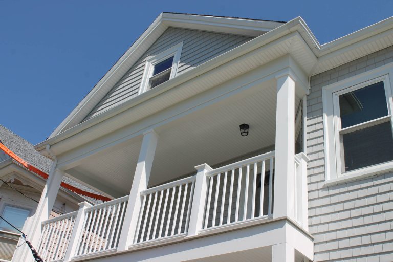 CertainTeed Cedar Impressions vinyl siding in Sterling Gray, AZEK Decking in Slate Gray, TimberTech Rails in White, New Bedford, MA. Photo credit by Care Free Homes, Inc. by Care Free Homes, Inc. | Outdoor Photos | Porch | Landscaping | Landscape Design | Outdoor Living Space | Porch Design Ideas | Outdoor Living Space Ideas | Backyard Design