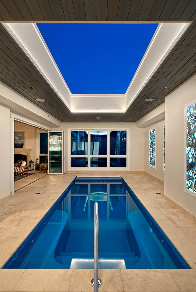Chicago Lakeview home remodel includes an indoor pool with retracting skylight and open to four seasons room. Norman Sizemore-Photographer