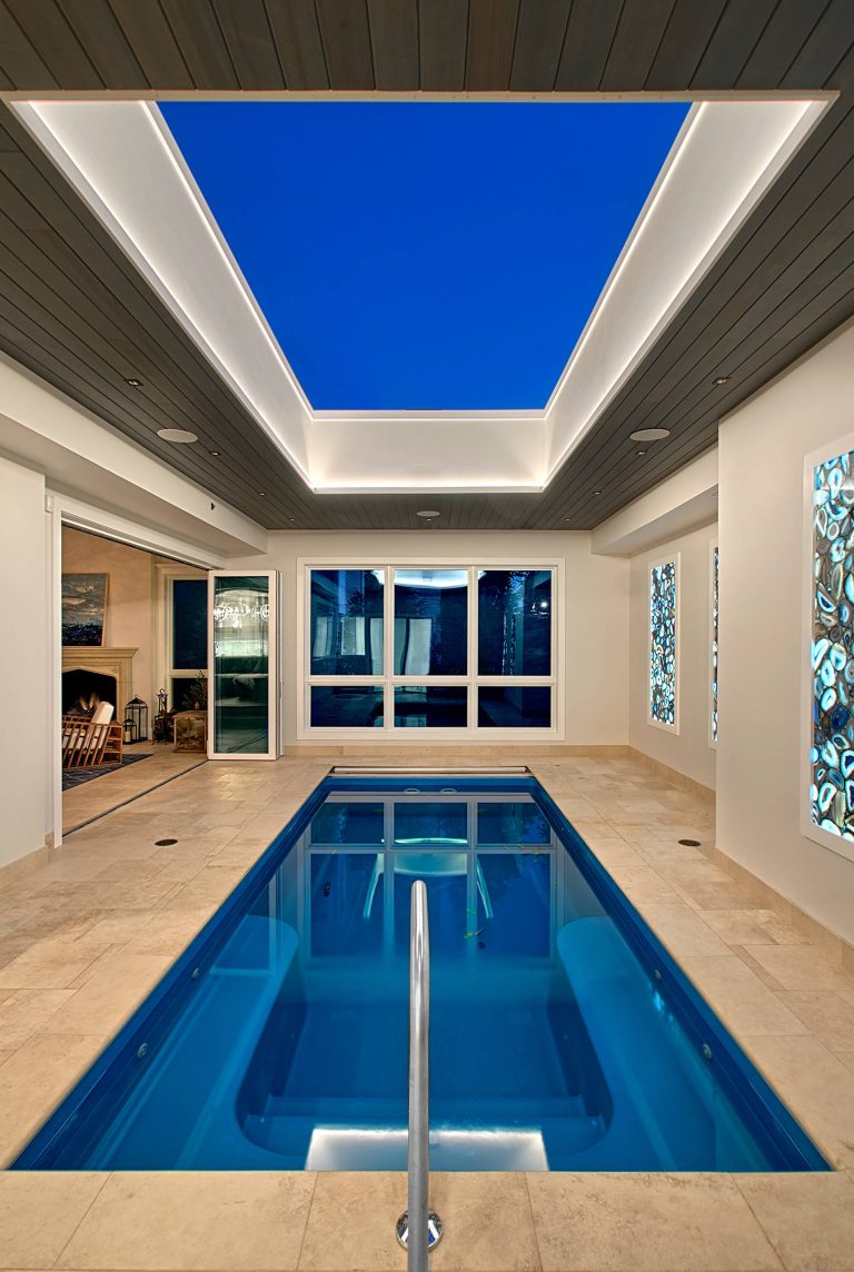 Chicago Lakeview home remodel includes an indoor pool with retracting skylight and open to four seasons room. Norman Sizemore-Photographer