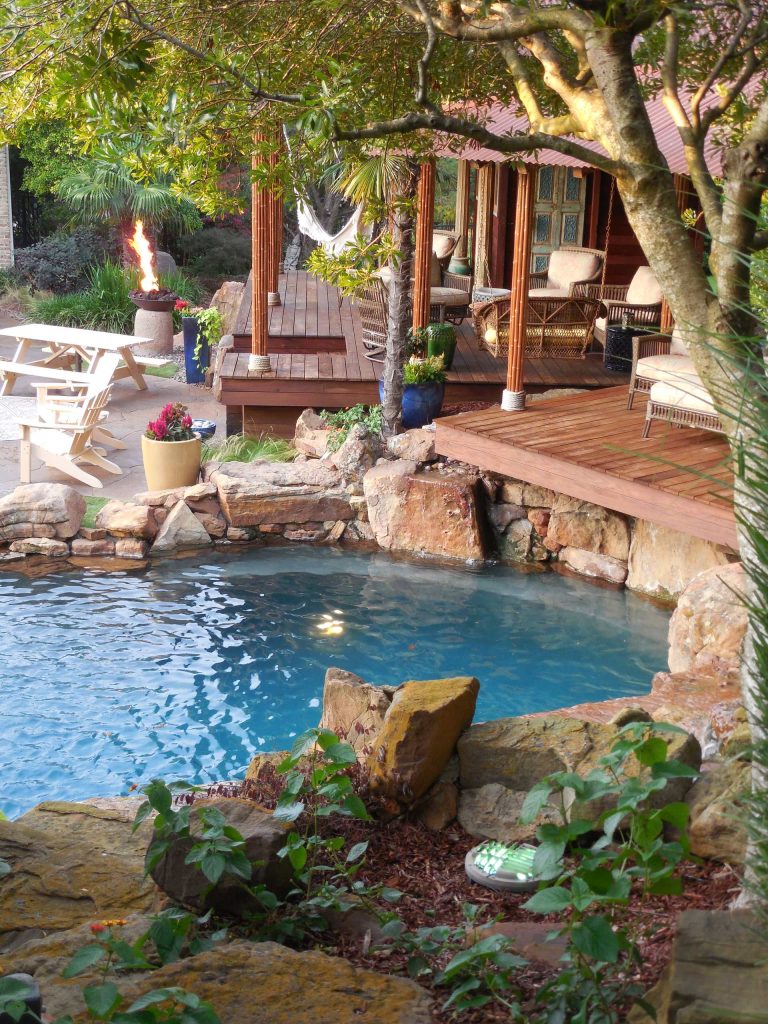 Complete natural stone outdoor oasis featuring pool, separate 10 person spa, koi pond, grotto, waterfalls, island and cabana. Featured on Discovery Animal Planets show The Pool Master.