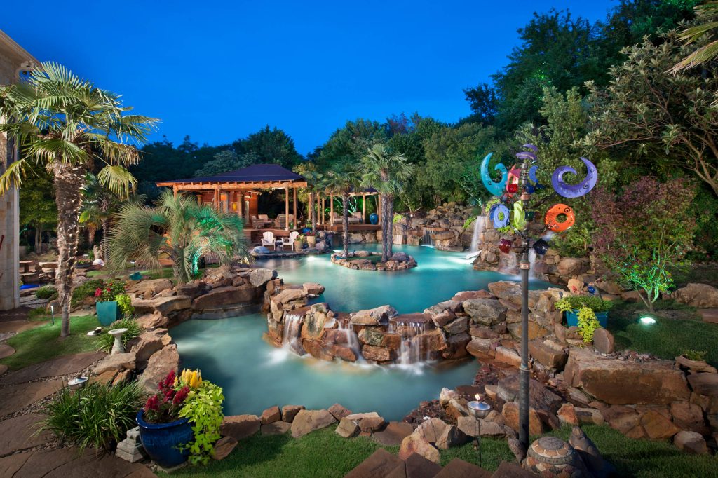 Complete natural stone outdoor oasis featuring pool, separate 10 person spa, koi pond, grotto, waterfalls, island and cabana. Featured on Discovery Animal Planets show The Pool Master.