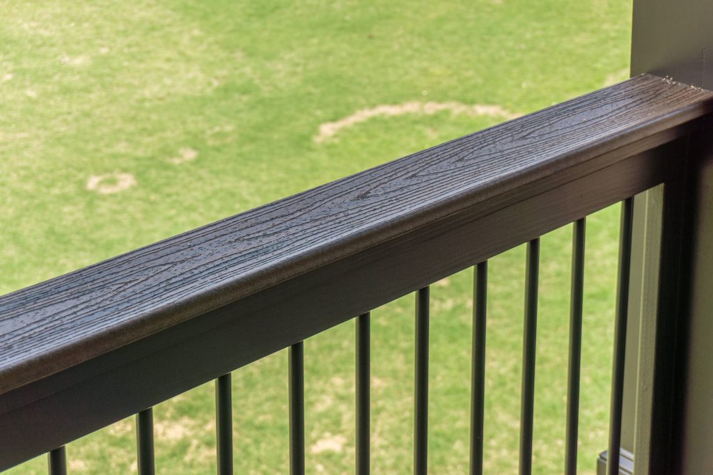 Composite Deck with Trex Transcend Spiced Rum and Screened-in Porch. Built by Decksouth.