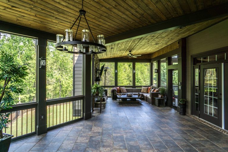 Composite Deck with Trex Transcend Spiced Rum and Screened-in Porch. Built by Decksouth.
