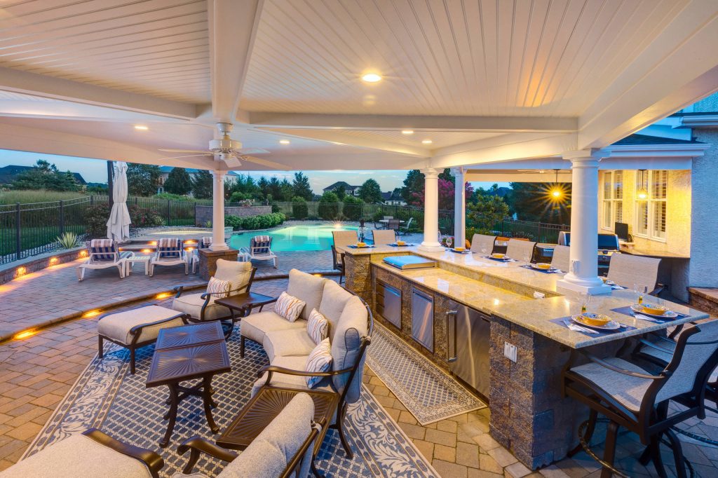 Concrete paver porch idea in Wilmington with a pergola