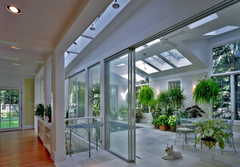 Conservatory addition, adjacent to Family Room and Kitchen, features a series of large sliding glass doors for humidity isolation

Ken WynerPool - modern pool idea in DC Metro by Van Dusen Architects | Pool design | Pool Contracting | Swimming Pool Ideas | Swimming Pool Design Ideas