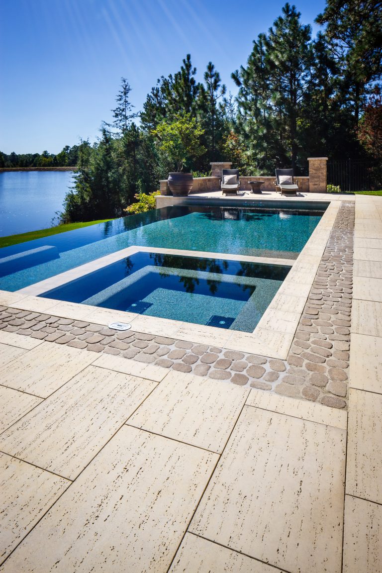 Contemporary Style Poolside using Techo-Bloc's Travertina slabs, Antika paver, and Bali Travertina caps.