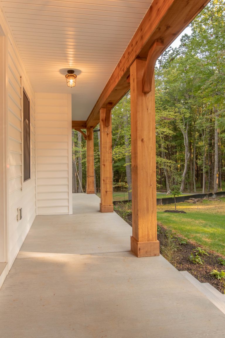 Cottage concrete porch photo in Baltimore with a roof extension by Ten Oaks Homes | Outdoor Photos | Porch | Landscaping | Landscape Design | Outdoor Living Space | Porch Design Ideas | Outdoor Living Space Ideas | Backyard Design