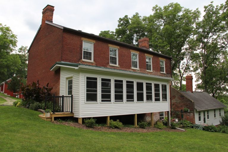 Country porch photo in Cleveland by D.C. Curry Lumber Company | Outdoor Photos | Porch | Landscaping | Landscape Design | Outdoor Living Space | Porch Design Ideas | Outdoor Living Space Ideas | Backyard Design