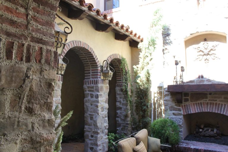 Courtyard Fireplac with stone and brick arches. Matched a picture taken in Italy