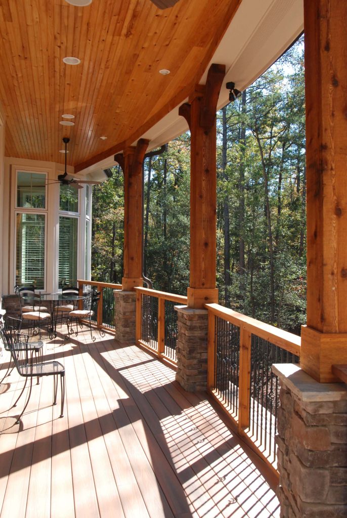Covered Porch with cedar beams and tongue and groove ceiling.