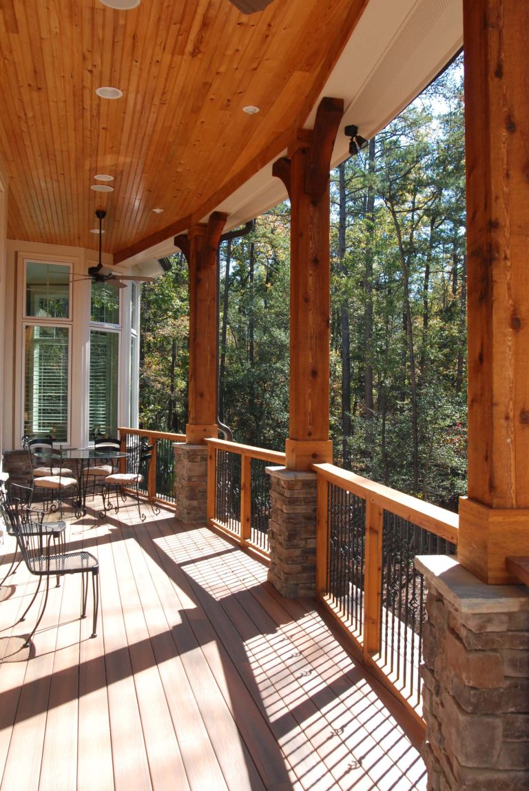 Covered Porch with cedar beams and tongue and groove ceiling.
