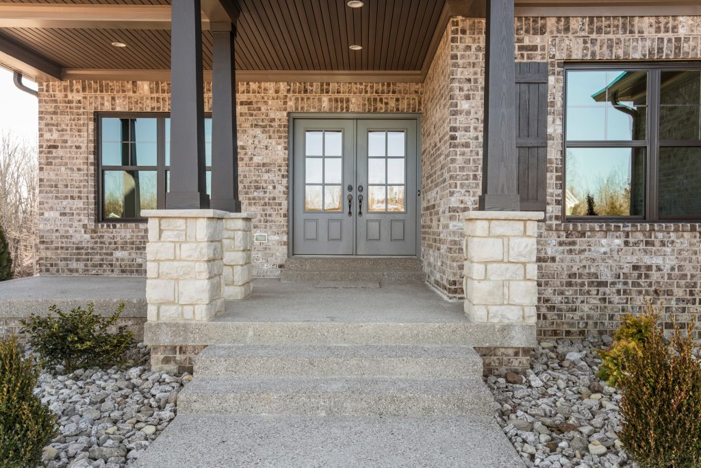 Covered front porch with french doors.