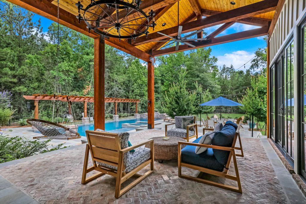 Covered porch overlooking pool area