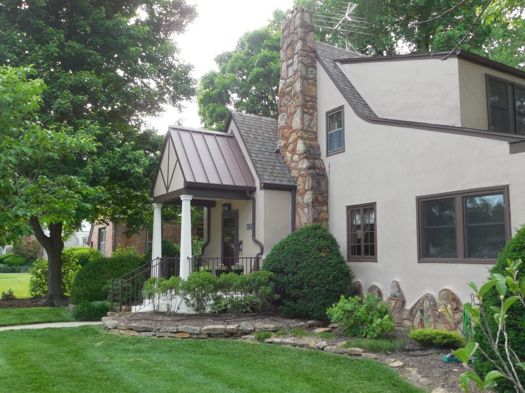 Craftsman Style Front Porch Addition. Custom Steel roof, stucco finish 'After' Photo: Marc EkhauseArts and crafts porch idea in Other by Marc Ekhause Home Builder and Custom Renovations | Outdoor Photos | Porch | Landscaping | Landscape Design | Outdoor Living Space | Porch Design Ideas | Outdoor Living Space Ideas | Backyard Design