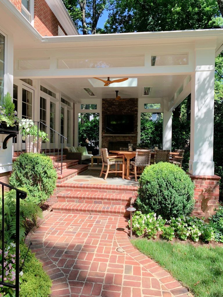 Curved walkway to the covered porch