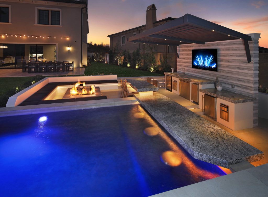 Custom Bar Pool Seating, Fireplace, & Outdoor Kitchen Area