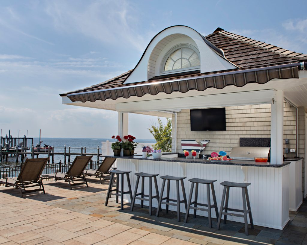 Custom Wood Product's - Atlantis Outdoor Cabinetry. "Naples" door style in Classic White on Perma-Tek. "Blue Sapphire Leathered" Granite countertops. Photo: John Martinelli, Contractor: Thomas J. Keller by Francie Milano Kitchens inc. | Outdoor Kitchens | Backyard Design | Outdoor Living Spaces | Landscape Design