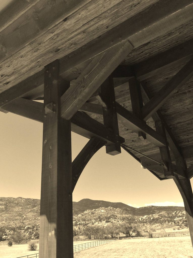 Custom fabricated trusses overhanging rear porch.