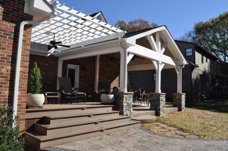 Custom gabled porch with stone post bases, integrated composite deck with flared stairs down to stamped concrete patio / fire pit. Floating pergola over composite deck in Columbia, TN. by Archadeck of Nashville | Outdoor Photos | Porch | Landscaping | Landscape Design | Outdoor Living Space | Porch Design Ideas | Outdoor Living Space Ideas | Backyard Design