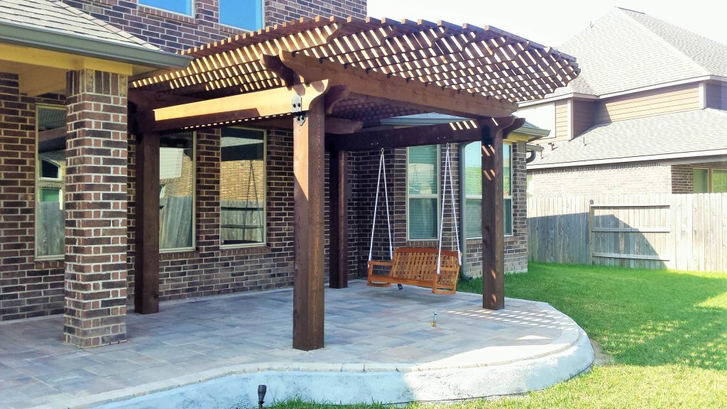 Custom made curved pergola to match the shape of the paver patio we also designed and installed