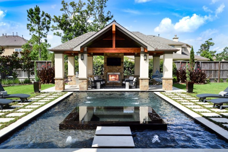 Custom matching pool house and cabana, stone fireplace, outdoor kitchen, lounge area and swim up bar.